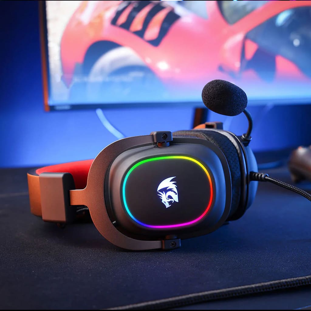 Redragon H510 Zeus-X RGB wired gaming headset on a mousepad, ready for gaming with RGB lighting active