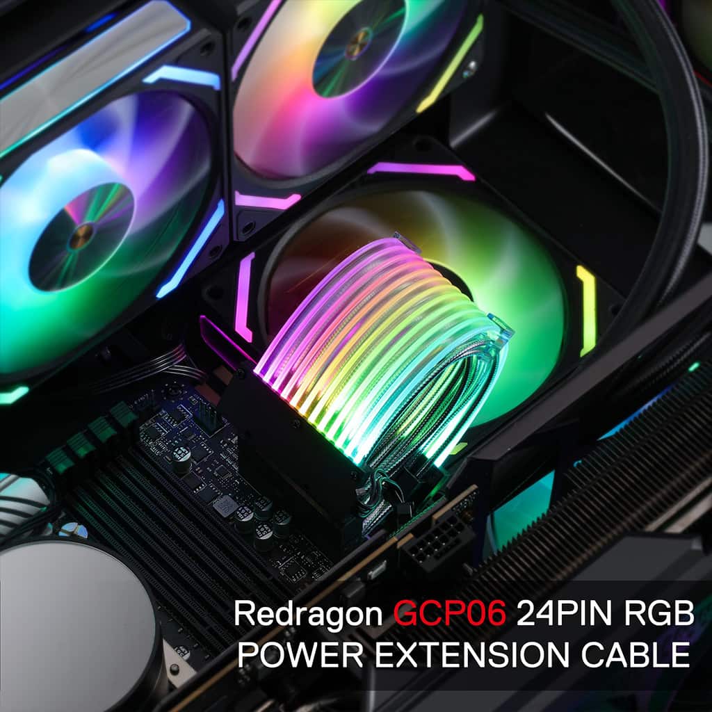 A close-up of a computer interior highlights a Redragon GCP06 24-pin RGB power extension cable glowing with multi-colored lights.