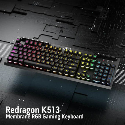Redragon K513 Aditya full-size membrane gaming keyboard from above, showcasing its design and colorful RGB illumination with text.