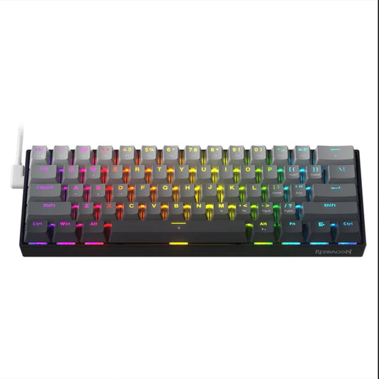 Redragon K617 Fizz 60% mechanical gaming keyboard with rainbow RGB backlighting and a white USB cable connected on the left side