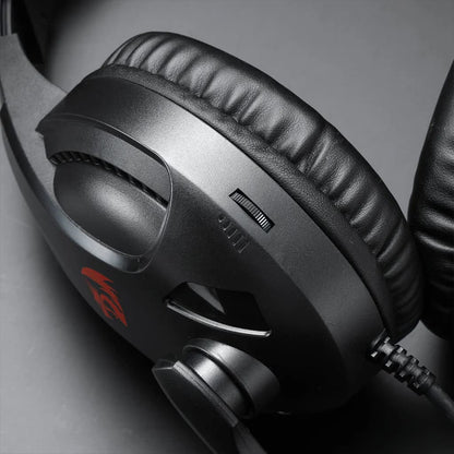 Close-up of the volume wheel on the Redragon H211 Cronus gaming headset earcup