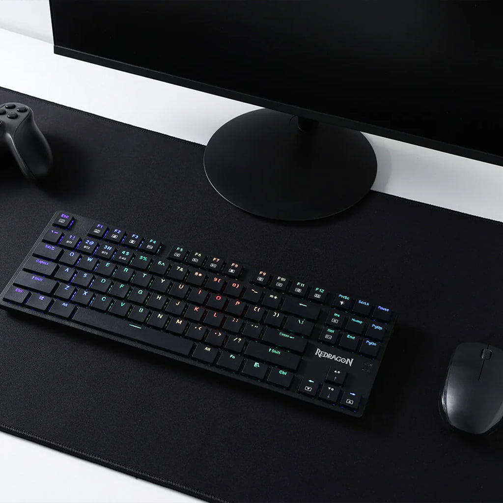 Redragon K539 Anubis Black RGB Mechanical Keyboard on a gaming setup with vibrant customized RGB lighting 