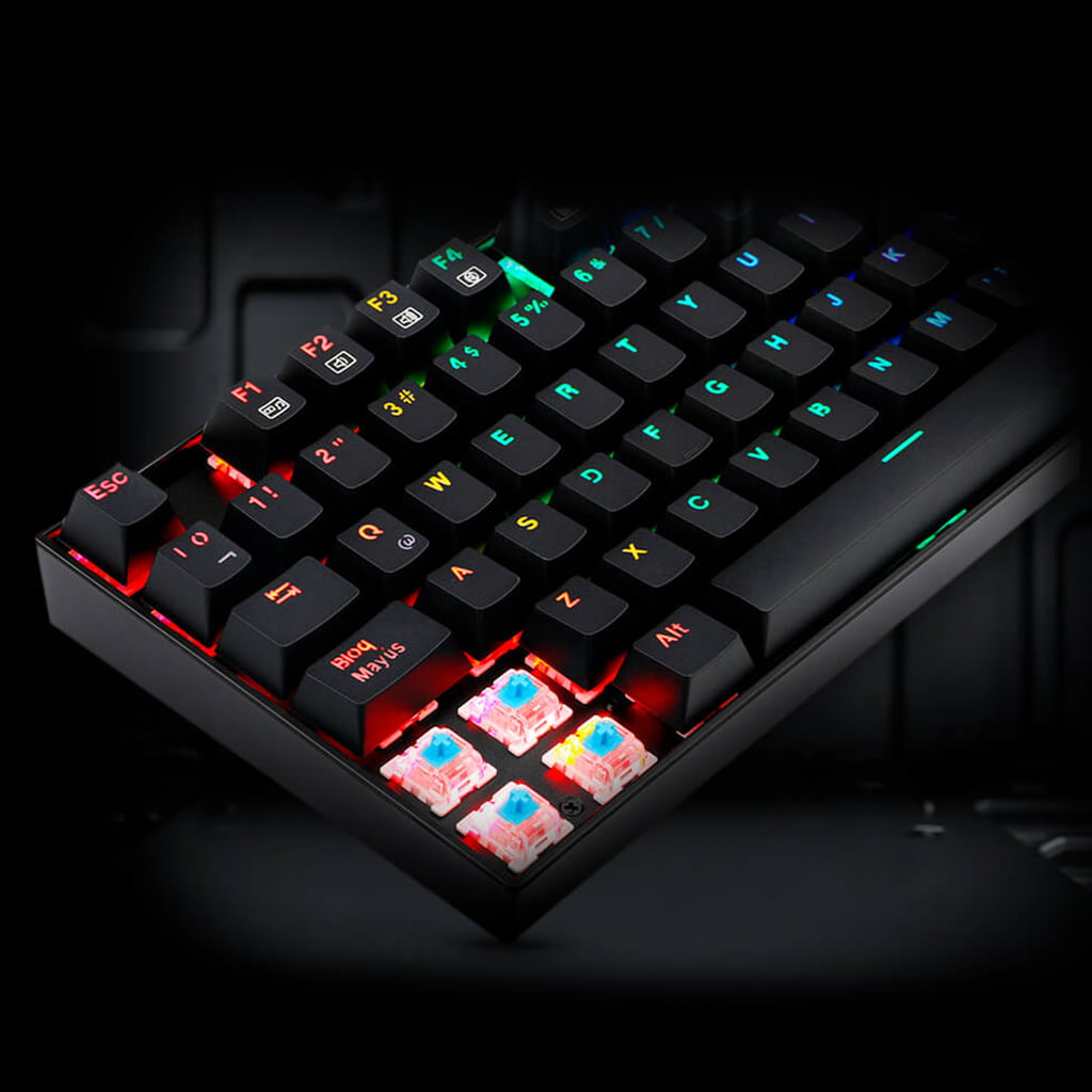 Close-up of the Redragon K551 MITRA RGB mechanical keyboard showing several keycaps and the underlying switches with RGB lighting.
