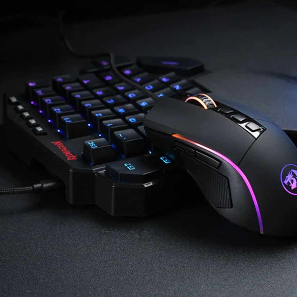 Redragon K585-BA one-handed gaming keyboard and M721-Pro gaming mouse combo form the front view with customizable RGB backlit