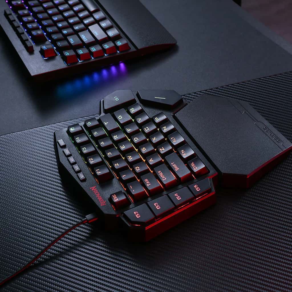 Redragon K585 DITI One-Handed Keyboard, showcasing its multi-color RGB backlighting & its detachable magnetic wrist rest