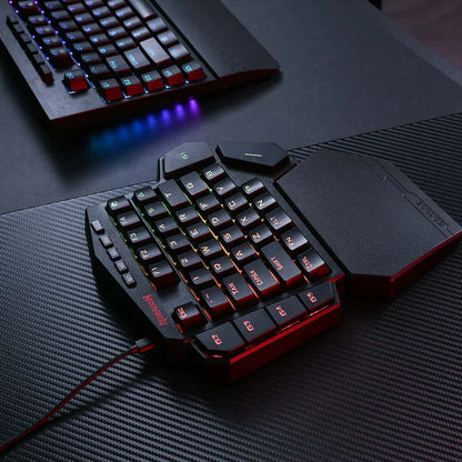 Redragon K585 DITI One-Handed Keyboard, showcasing its multi-color RGB backlighting & its detachable magnetic wrist rest