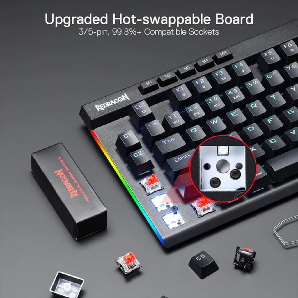 Close-up of Redragon K587 MAGIC Pro keyboard featuring hot-swappable sockets for 3/5-pin switches and colorful RGB lighting