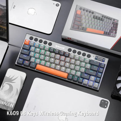 Redragon K609 Horus SE RGB Mechanical Keyboard setup with laptop and accessories