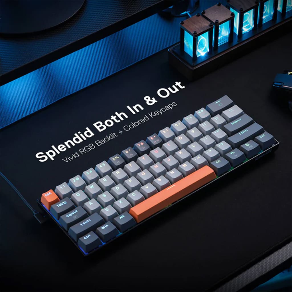 Redragon K644 CARAXES RGB Gaming Keyboard, showcasing its compact 65% layout with all keys illuminated by vibrant RGB backlighting