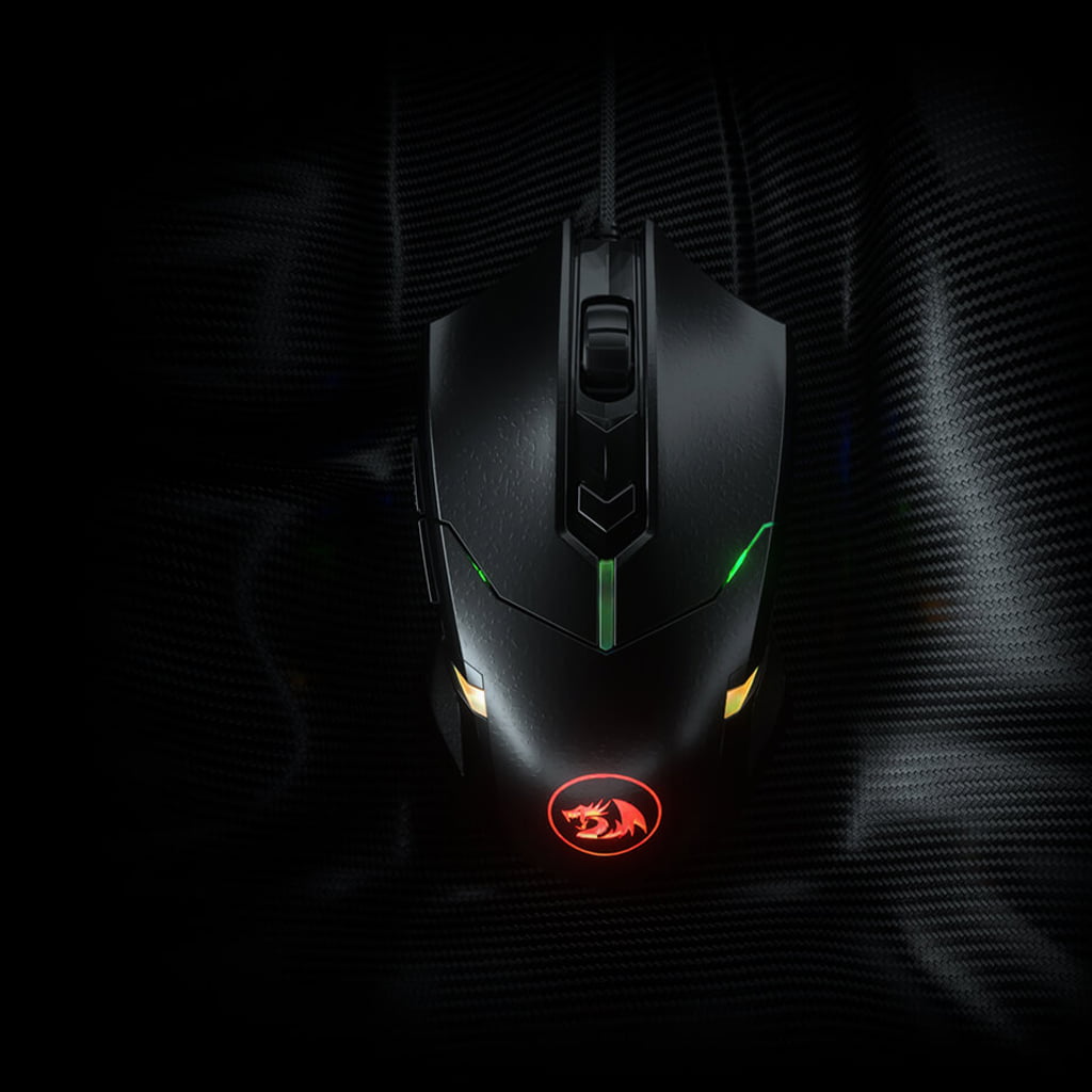 Top-down view of the black Redragon M601 Centrophorus RGB  mouse on a textured surface, showcasing its design & RGB lighting 