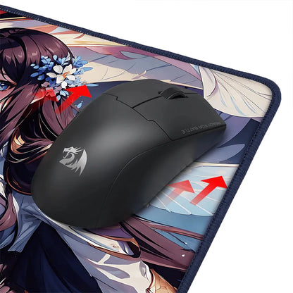 Black gaming mouse on an anime-style mouse pad with a detailed design
