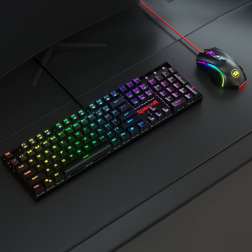 Top view of black Redragon K551 RGB-BA mechanical gaming keyboard & M607 Black RGB gaming mouse combo set on a desk surface